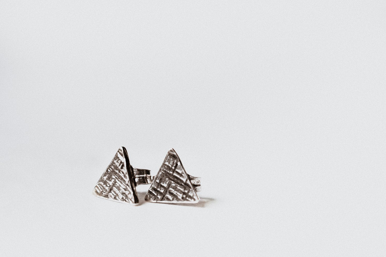 Sterling silver hammered tiny triangle studs earrings Amanda K Lockrow 